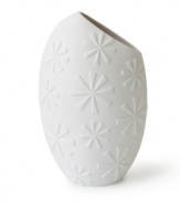 A modern shape and askew opening in matte white porcelain make the Charade Slice vase from Jonathan Adler a must for artful arrangements.