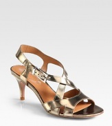 A practical heel lifts this strappy summer essential of lustrous metallic leather. Self-covered heel, 2¾ (70mm)Metallic leather upperAdjustable ankle strapLeather lining and solePadded insoleImportedOUR FIT MODEL RECOMMENDS ordering true size. 