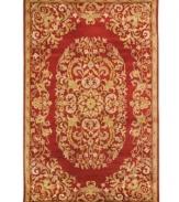 Rich in both tone and tradition, this exquisite Safavieh area rug creates a unforgettable focal point with a vine-and-blossom motif that coils beautifully against a striking red background. Tufted in India from pure wool, this rug adds incredible allure to any space. (Clearance)