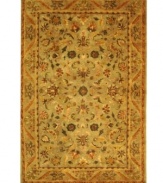 Lavish your space in timeless tradition, set in soft shades of sage on this exquisite area rug from Safavieh. Tufted in India from pure wool, this rug emerges from the annals of antiquity to bring spectacular style and time-honored quality to your home. (Clearance)