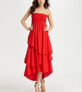 Vivacious strapless silhouette with a tiered hem can be folded over at the hips and worn as a maxi skirt. StraplessTiered hi-low hemAbout 26 from natural waistRayonDry cleanImportedModel shown is 5'10 (177cm) wearing US size Small.