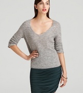 Touting soft tailoring and classic styling, this Halston Heritage sweater slips on for effortless elegance.