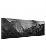 Looming larger than life in black and white, the Sierra Nevada mountains define the awe-inspiring landscape of Yosemite Valley in this impressive gallery-wrap canvas print. A room-defining piece by artist Ashley Beck.