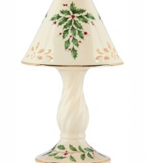 With bands of gold, pierced detail and a holly motif to match the beloved Holiday dinnerware pattern, this porcelain candle lamp from Lenox creates instant Christmas ambiance.