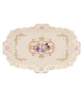 Accent your bedroom or bath with a vanity tray fit for a princess. Cinderella's pumpkin coach adorns ivory porcelain with gold swirls, twinkling stars and pretty pink hearts. A scalloped edge and raised beading refine the ultra-feminine Disney piece. Qualifies for Rebate