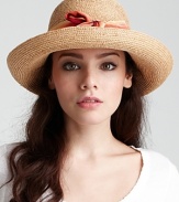 A charming raffia sun hat with rolled brim and ombré ribbon trim.