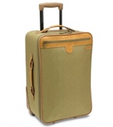 A world traveler. Expanding for more space, this charming suitcase packs in the features that jet-setters demand, such as two separate packing areas, restraining straps to secure garments and a removable garment sleeve. The antique brass hardware and Hartmann's signature trim add a sophisticated look to your travel style. Lifetime warranty.