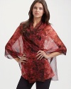 Signature skulls and blooming florals on sheer silk georgette.About 27½ X 78¾ Dry clean Made in Italy 