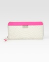 Gorgeous python-embossed leather pairs with bold contrast trim in this sleek continental silhouette.Zip-around closureOne outside open pocket Center zip compartmentOne bill slotSix credit card slotsFully lined7½W X 4H X 3/4DImported