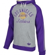 Keep warm as you cheer and rant for the LA Lakers in this pullover hoodie by adidas.