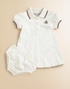 Soft, airy pique knit with sporty stripes, perfect for your future tennis star.Ribbed polo collar with two-color striped tippingShort sleeves with ribbed, tipped cuffsButton placketLogo appliqué at chestBox pleated hemMatching bloomer with elasticized waist and leg openings96% cotton/4% elastaneMachine washImported Please note: Number of buttons may vary depending on size ordered. 