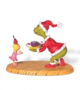 A scene right out of the Dr. Seuss classic! The devious Grinch, posing as Santa Claus, charms little Cindy Lou Who with a midnight snack when he's caught trying to steal Christmas!