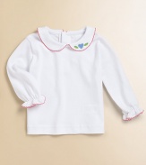 A shirt almost as precious as baby with a classic Peter Pan collar, picot trim and heart appliqué.Peter Pan collarLong sleevesBack buttonsCottonMachine washImported