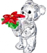 Kris Bear is ready for Christmas, clutching a beautiful poinsettia plant in a Swarovksi crystal collectible that'll shine year after year. Leg engraved with 2012.