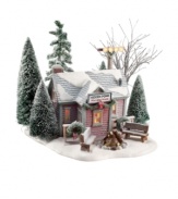 After an invigorating skating session, village residents gather for hot cups of cocoa and treats in this quaint warming house by Department 56. It features snow-dusted pines, benches around a fire, and outdoor lights for skating after dark.