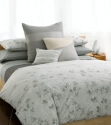 Serenity now. Create a calm atmosphere of luxury with the Quince comforter from Calvin Klein. A watercolor print of stone and green florals adorns this ultra-soft comforter in 100% pure combed cotton percale, evoking the essence of natural beauty with a purely modern allure. Self reversing. (Clearance)