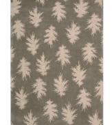 Falling leaves impart jagged-edged style balanced by a solid carbon background. Hand tufted from 100% natural wool, this plush Calvin Klein rug is crafted using the cut-and-loop pile technique that creates a unique matte surface texture.