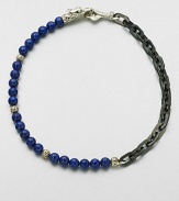 A brilliant strand of smooth lapis beads joins together with intricate links of sterling silver and stainless steel, and is finished with a sculpted sterling silver clasp.LapisSterling silver/stainless steelAbout 3 diam.Imported