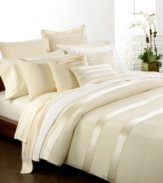 Elegant simplicity! These Essentials Ivory pillowcases from Donna Karan add elegance and comfort to your bed with 410-thread count Egyptian cotton percale and saddle stitch details.