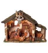 A warm & hopeful glow illuminates the humble stable where Mary, Joseph and a triumphant angel share a quiet, adoring moment. Crumbling brick walls and a menagerie of livestock surround the glorious baby Jesus as he lays his head in the manger.