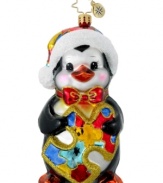 Wish for autism awareness with this charity ornament from Christopher Radko. A cute penguin clutches a colorful puzzle piece – the symbol of autism advocacy organization, Autism Speaks.