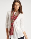 A textural design with baby fringe detail in a luxurious cashmere and merino wool blend. 55% extra fine merino wool/45% cashmereAbout 17¾ X 78¾Dry cleanImported 
