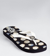 Curious hedgehogs roam across a printed pair of Tory Burch flip flops.