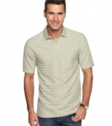 Lose the dress shirt and kick back for the weekend in this striped polo shirt from Van Heusen.