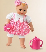 This cute baby doll, with blue, blink eyes and painted blonde hair, wears a pink, with white hearts, print, bubble romper over a white knit onesie. Pink, white and green striped binding along with a white bow on the front add accents to the romper. A gathered, heart and flower, striped headband, that has a bow, completes her outfit. This baby comes with a pink sippy cup and pink Teddy.14 plastic and fabric dollRecommended for ages 3 and upImported