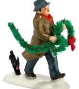 Bringing home the holly, this dapper fellow is trailed by a family dog who can't contain his excitement. A humorous figurine from Snow Village, by Department 56.