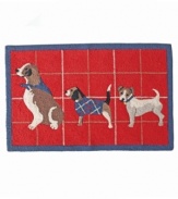 Put a bit of pep in your step with this adorable Holiday Dog accent rug. Features a trio of cute pups with a red plaid backdrop to fill your home with some holiday cheer.