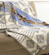 Into the wild. An original design from Pendleton in the 1920's, this truly luxurious Silver Bark Heritage blanket is inspired by the white and silver bark of aspen trees against a blue sky. Finished with suede trim.