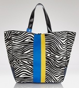 Work a two tone vibe with this tote from Juicy Couture. An updated take of the brand's much loved day bag, this glam style flaunts bold black and white stripes and cool color blocked detailing.