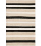 An ultra-modern design inspired by artisan flat weave carpets of Turkey and India, the Narragansett Stripe area rug from Lauren Ralph Lauren is woven by hand in India of luxurious banana silk with a hint of cotton.