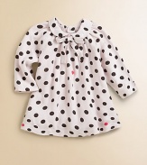 A precious cotton frock with Peter Pan collar and bold polka dots for your little girl.Peter Pan collar with bow tieLong sleevesBack buttonsCottonMachine washImported Please note: Number of buttons may vary depending on size ordered. 