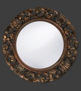 Open clamshells mingle with curling leaves in a mottled bronze ring with inner beading. Alluring on the bedroom, living room or foyer wall, this round mirror dresses up any space with timeless, lasting beauty.