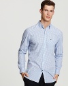 This classic fit sport shirt in a light blue mini gingham adds a playful touch to wardrobe basics.