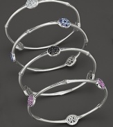 Three sparkling stations add brilliant color to this slim, elegant sterling silver bangle.