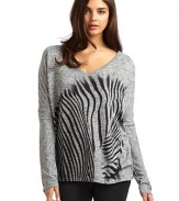 THE LOOKV-neckLong sleevesZebra graphicTHE FITAbout 27 from shoulder to longest part of hemTHE MATERIAL95% polyester/5% spandexCARE & ORIGINMachine washMade in USA