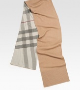Enhanced with iconic plaid checks on one side and solid color on the other, this timeless winter essential is crafted from luxurious cashmere.Rib-knit trim94 X 12CashmereDry cleanImported