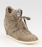 Sporty suede and canvas style, revived by a wide, self-covered wedge. Self-covered wedge, 3 (75mm)Suede and canvas upperLeather liningRubber solePadded insoleImportedOUR FIT MODEL RECOMMENDS ordering true whole size; ½ sizes should order the next whole size up. 