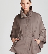 Complete your rainy day look with Calvin Klein's captivating cape, boasting a funnel collar with practical zip-out hood and flattering cinched waist.