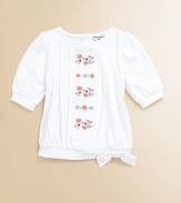 A charming short-sleeved top in soft cotton is accented with a blooming bouquet of embroidered flowers to inspire warm thoughts.Round necklineShort puff sleevesBack button closureTie hemCottonMachine washImported Please note: Number of buttons may vary depending on size ordered. 