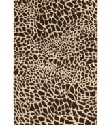 Survival of the prettiest. An exotic print adorns Nourison's Skyland rug in bold, contrasting chocolate and ivory hues, bringing a wildly chic look to any space. The plush wool rug is enhanced with meticulous hand carving for beautiful detail and texture.