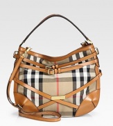 Rich leather wraps around pure cotton, adding sophisticated style to the classic Burberry check. Leather top handle, 4½ dropAdjustable, detachable leather shoulder strap, 22-24½ dropTop zip closureOne inside zip pocketTwo inside open pocketsCotton lining15W X 12H X 6DMade in Italy