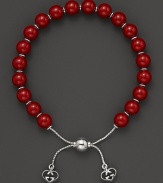 Varnished red wooden beads on a sterling silver bracelet from Gucci.