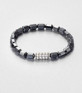 The Bedeg collection celebrates the simple, yet exquisite Indonesian artisanship found in woven bamboo with a modern design interpretation captured in traditional techniques. This beaded style is designed in sterling silver with hematite.Sterling silverHematitePusher claspDiameter, about 6Imported