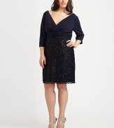 Wrapped in style, a matte jersey design with a flattering v-neck top, waist-flattering gathered details and a gorgeous sequin skirt.V-neckThree-quarter sleevesGathered waistSequin skirtBack zipperFully linedAbout 24 from natural waist70% rayon/30% polyesterDry cleanImported