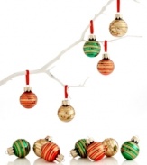 Decorate by the dozen! Wrapped in gold glitter, these shiny glass ball ornaments from Martha Stewart Collection make a big impact on your tree.