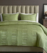 Luxe texture meets a serene green hue in this Key West sham from Bryan Keith for a calming oasis in the bedroom. Lush quilted details form an uneven stripe design with pops of muted color interspersed.